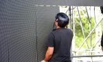 Technician,Working,On,Stage,Assembling,Giant,Led,Screen,Panels,For